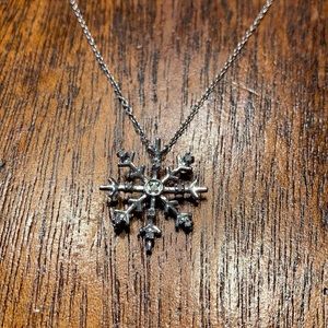 Silver snowflake pendant with cubic zirconia accents